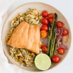 This Sheet Pan Honey Soy Salmon is the easiest dinner! This sheet pan salmon dinner only takes 15 minutes to cook after marinating!