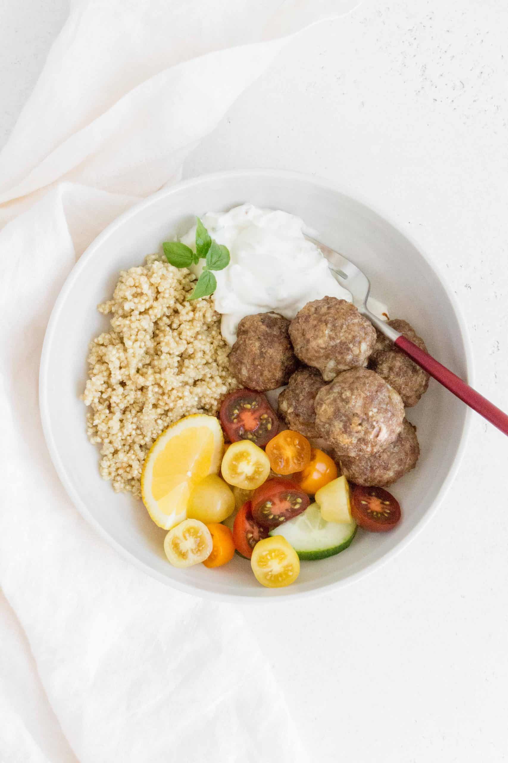 These healthy and delicious Greek Meatball served with a side of quinoa and tzatziki sauce are perfect dinner or meal prepping! The Greek meatballs are freezer friendly and full of flavour!