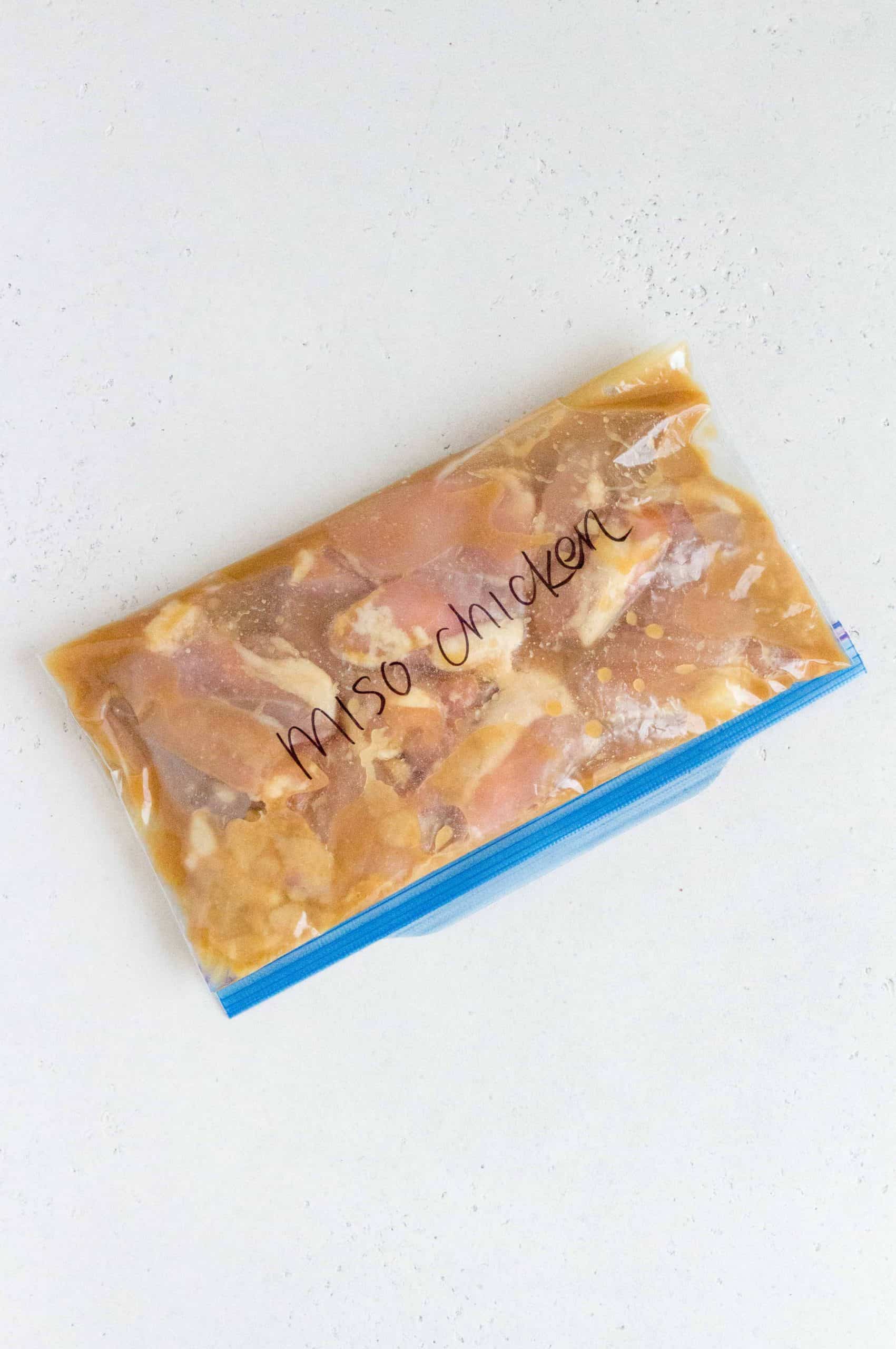 miso chicken in a freezer ziploc to be frozen as a freezer meal prep