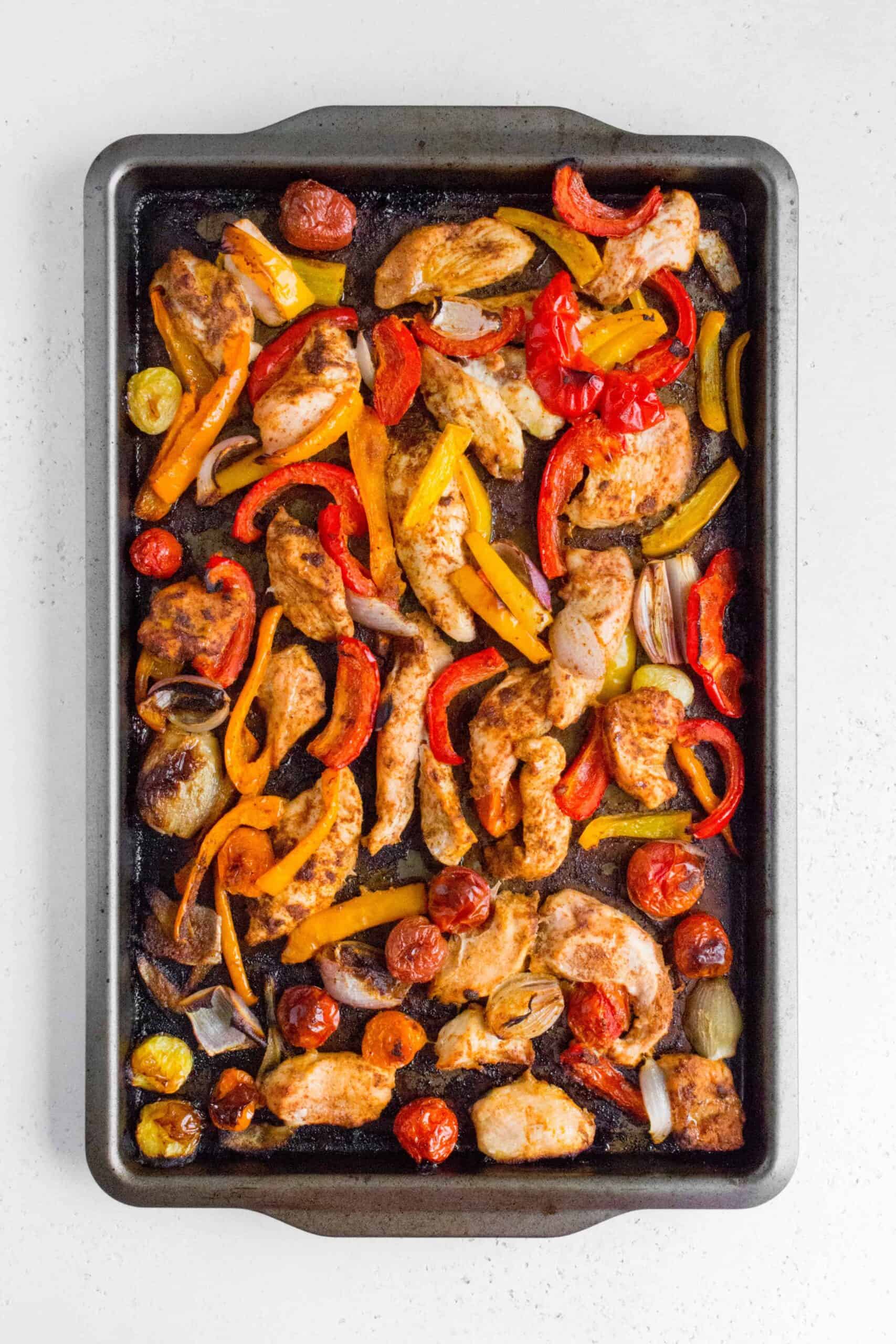 chili lime fajitas chicken in a sheet pan after roasting