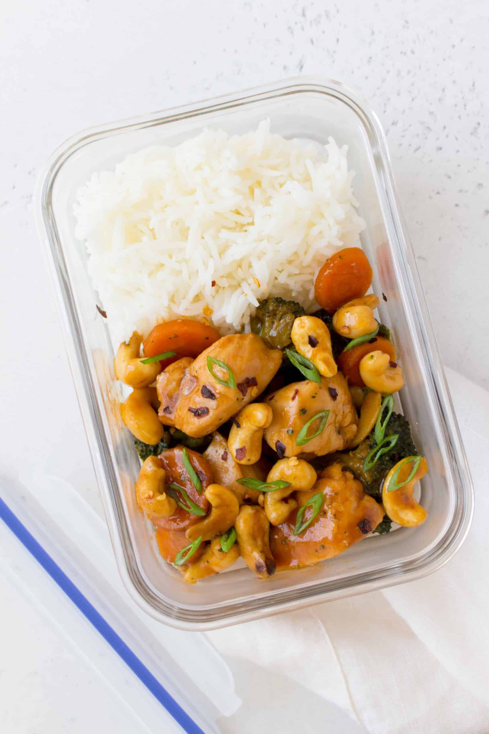 cashew chicken in a meal prep container with rice