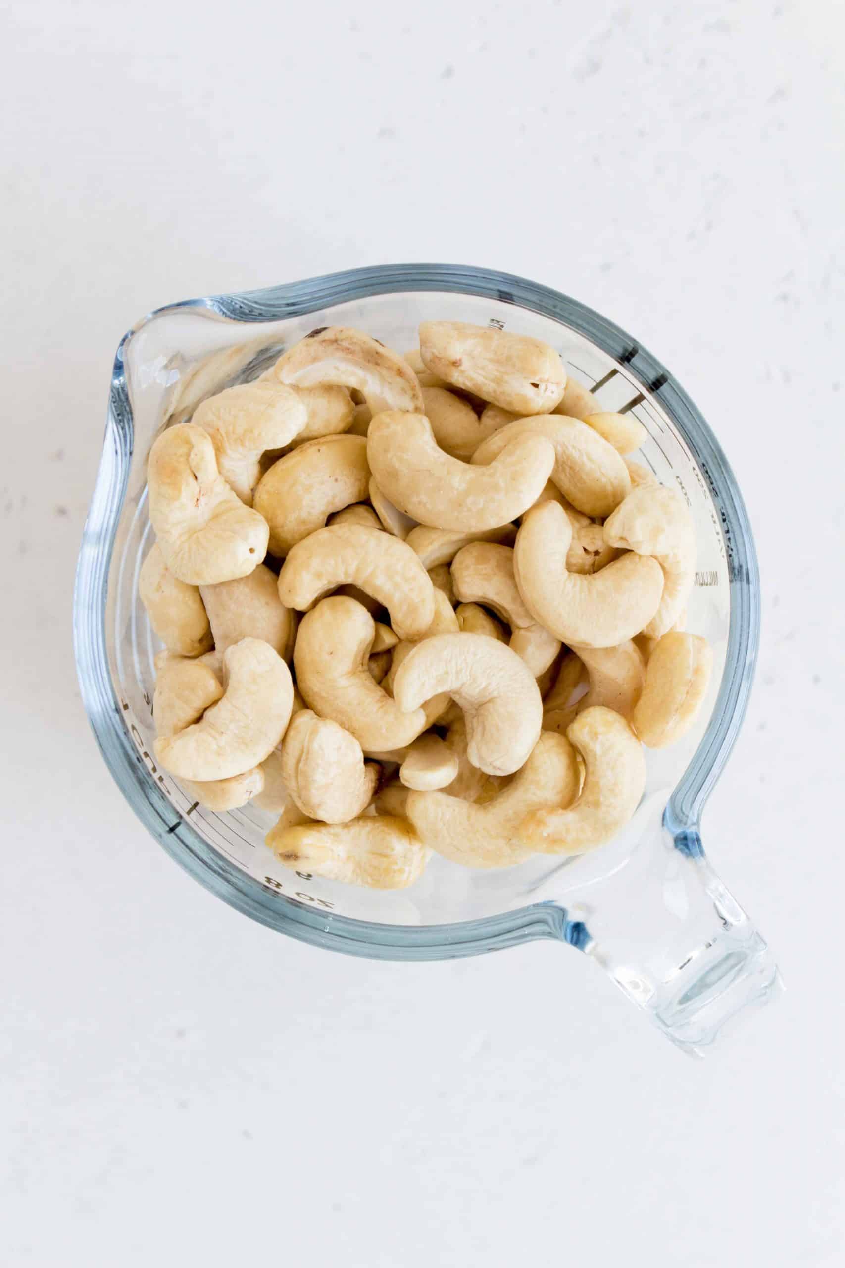 cashews in a measuring cup.