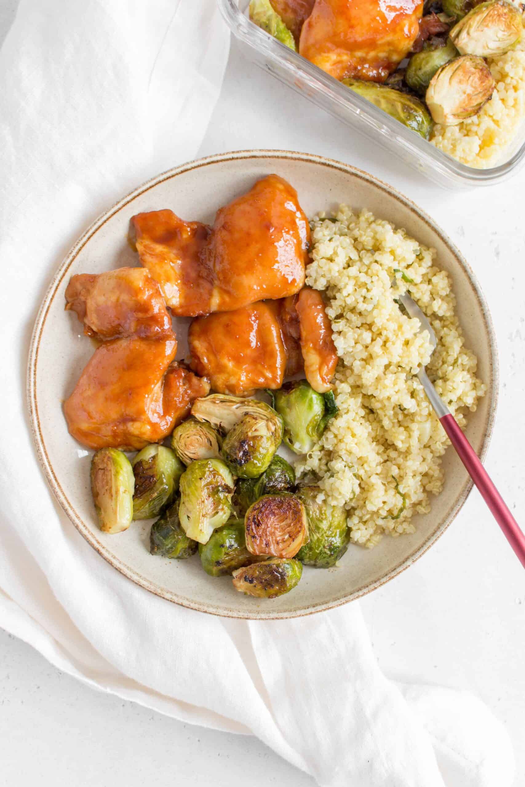 plate with chicken thighs and brussels sprouts