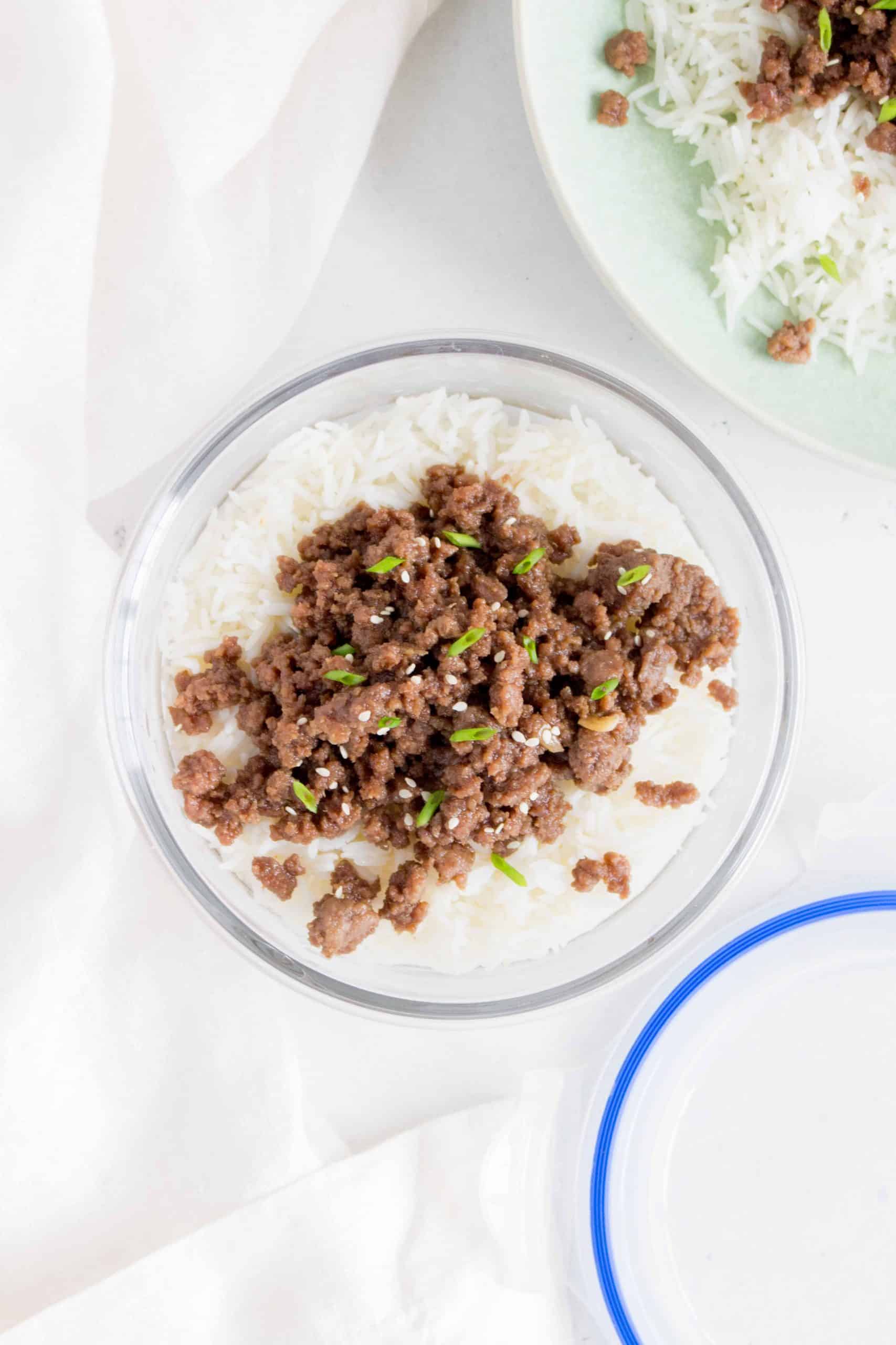 teriyaki ground beef on top of rice in a meal prep container