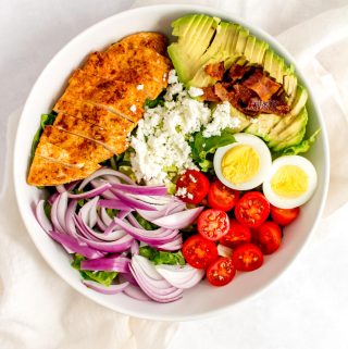 Overhead view of a bowl of chicken cobb salad.