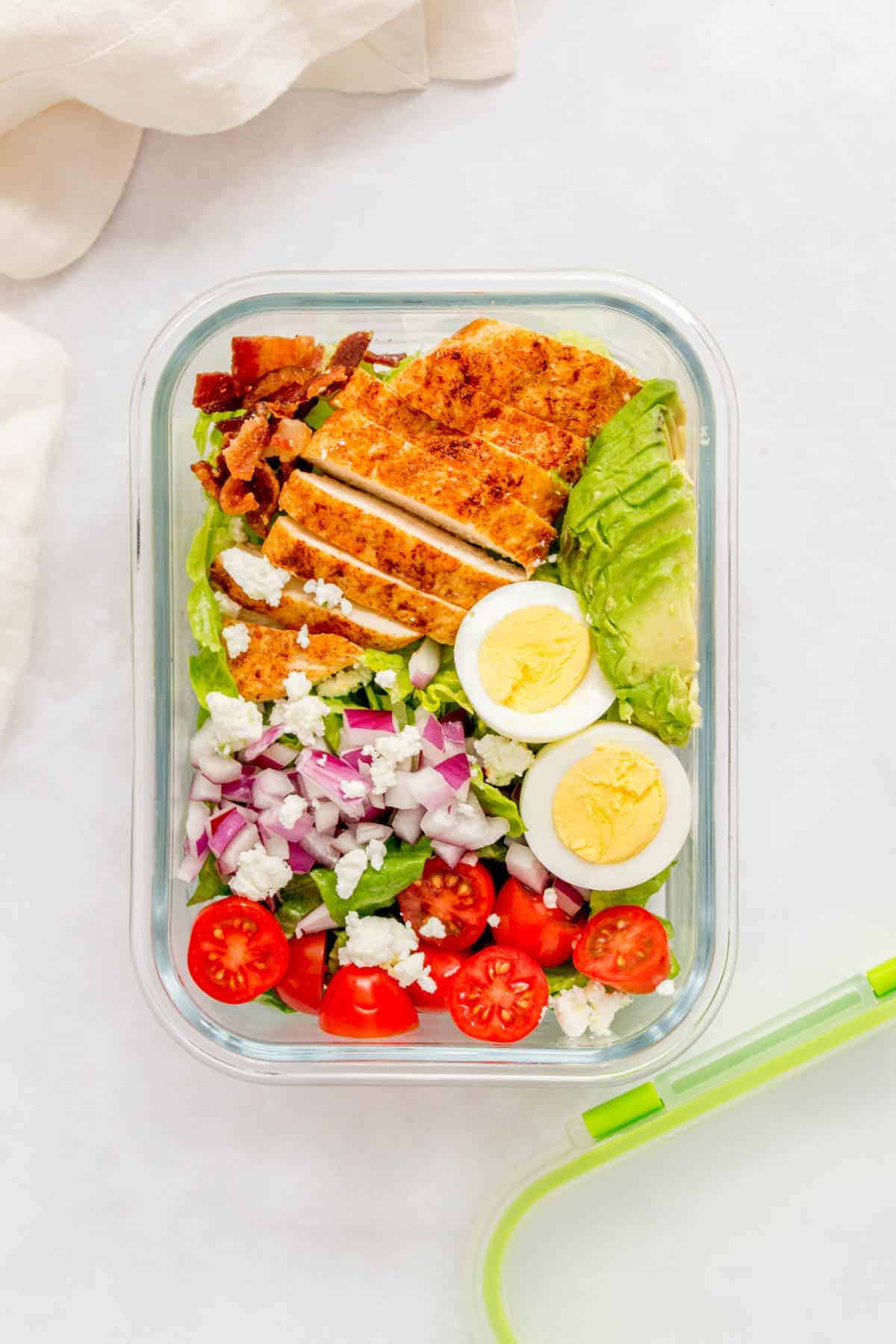 Packed with protein, this super easy healthy Chicken Cobb Salad doesn't take long to put together and is perfect if you're looking for a filling salad. It packs really well, making this cobb salad a perfect meal prep as well.