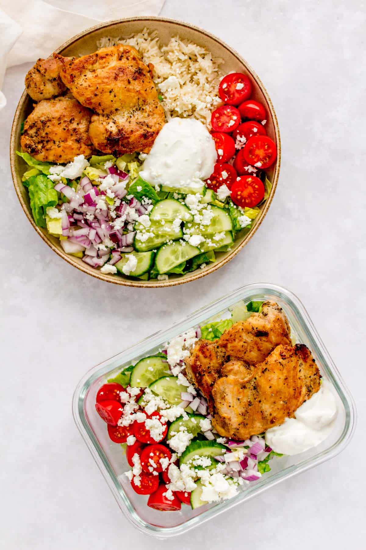 Herb chicken salad in a meal prep container and herb chicken rice bowl in a plate.