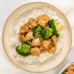 A bowl with rice topped with Instant Pot Asian chicken and broccoli.