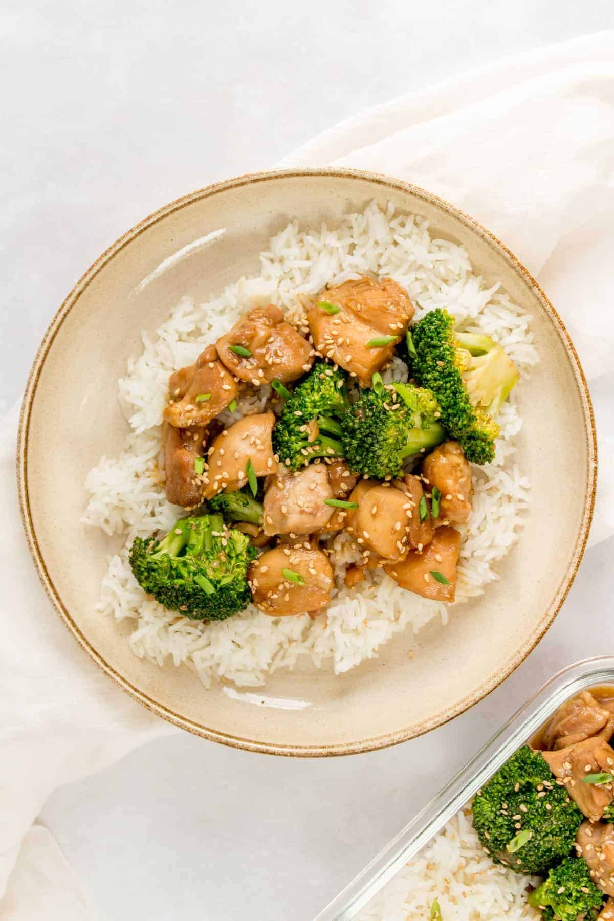 A bowl with rice topped with Instant Pot Asian chicken and broccoli.