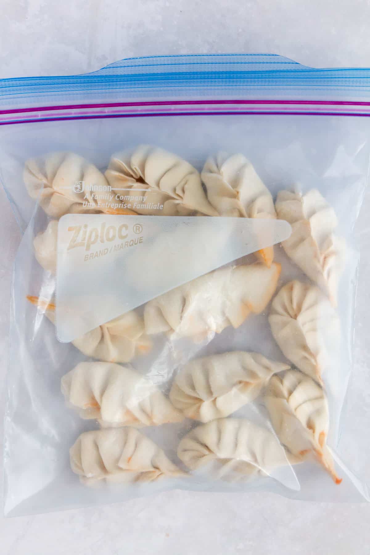 Frozen dumplings in a ziploc bag.