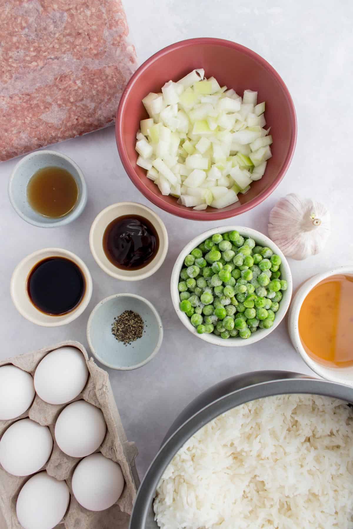 Overhead image of ingredients used to make beef fried rice.