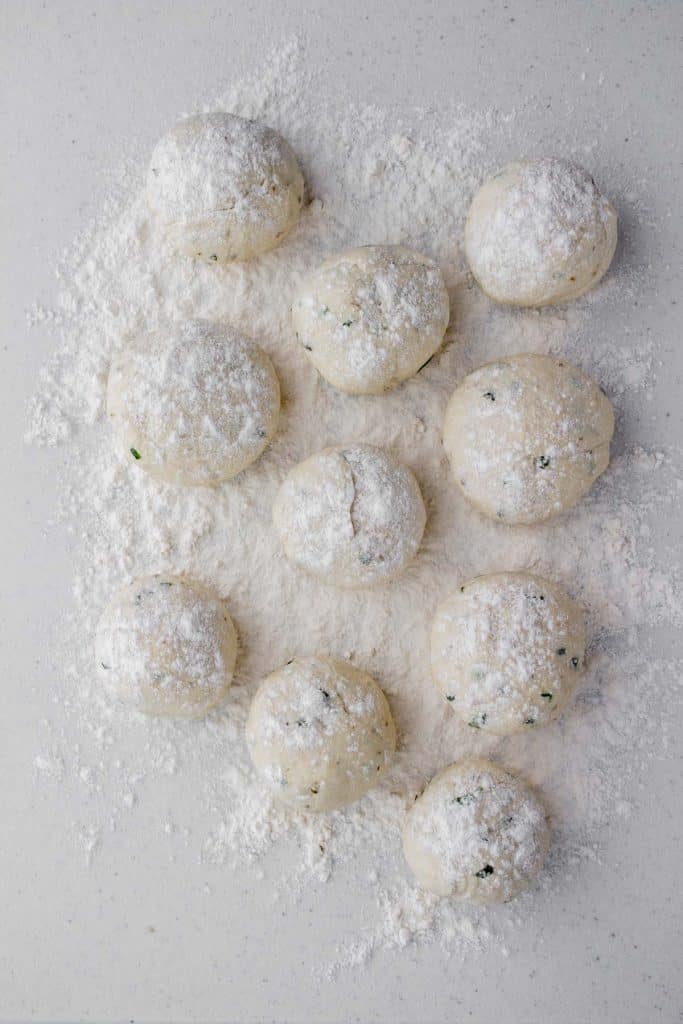 Dough balls for flatbread dusted with flour.