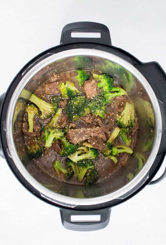 Instant pot beef and broccoli topped with sesame seeds.