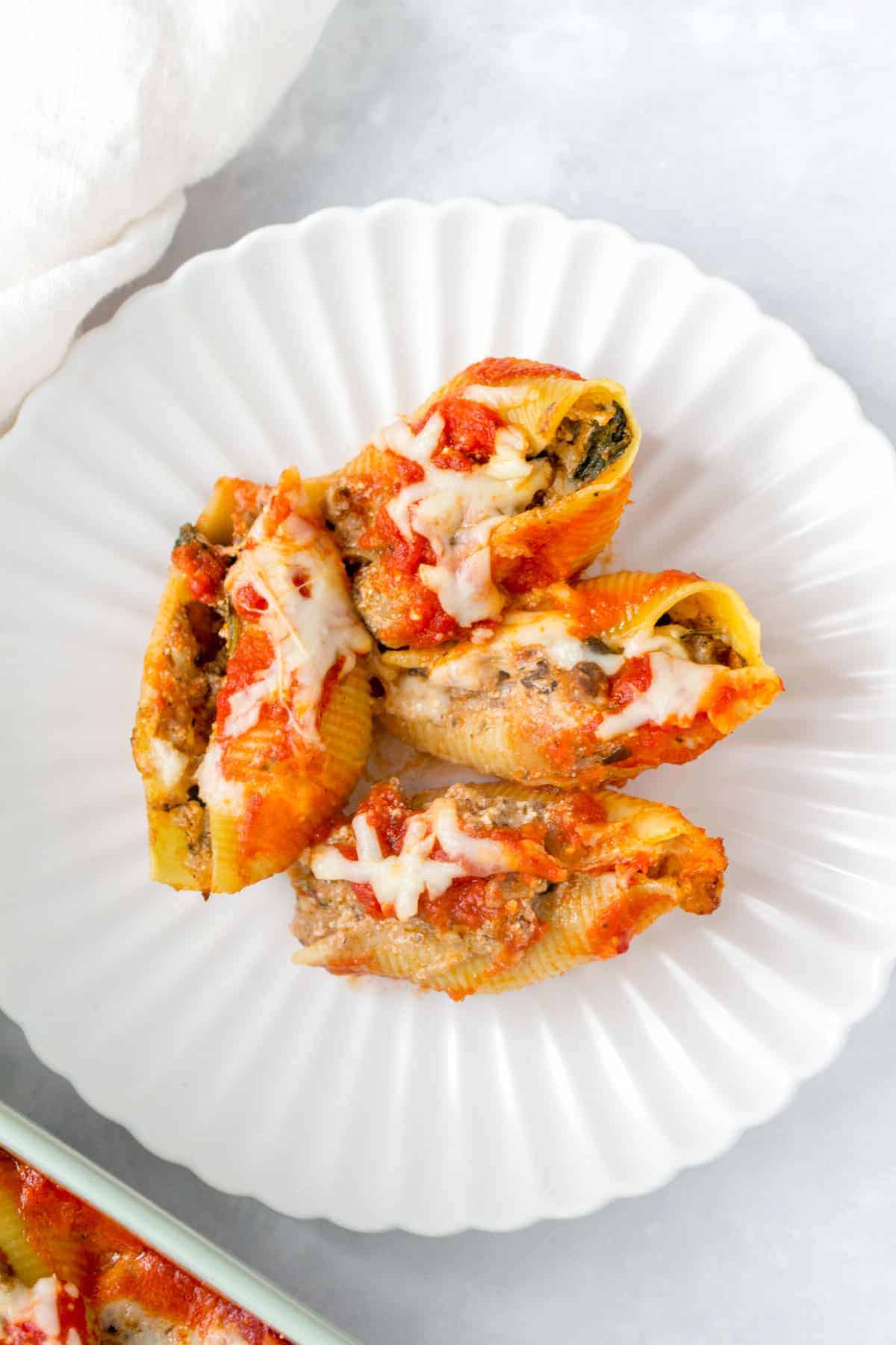A plate with lasagna stuffed pasta shells.