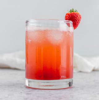 A glass of homemade strawberry basil soda.