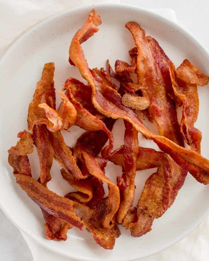 Close up of a plate of bacon made with an air fryer.