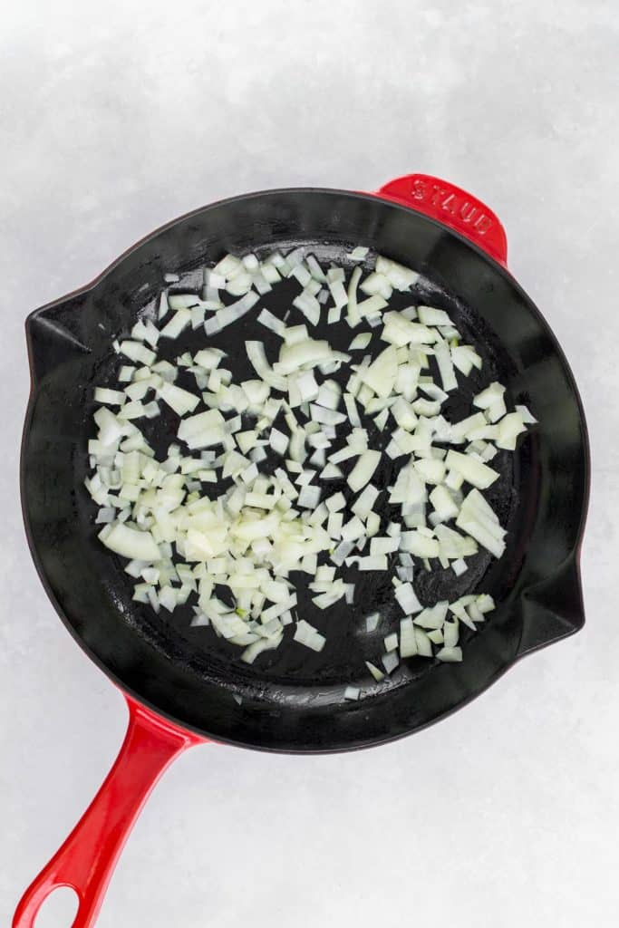 Onions sautéed with butter in a cast iron.