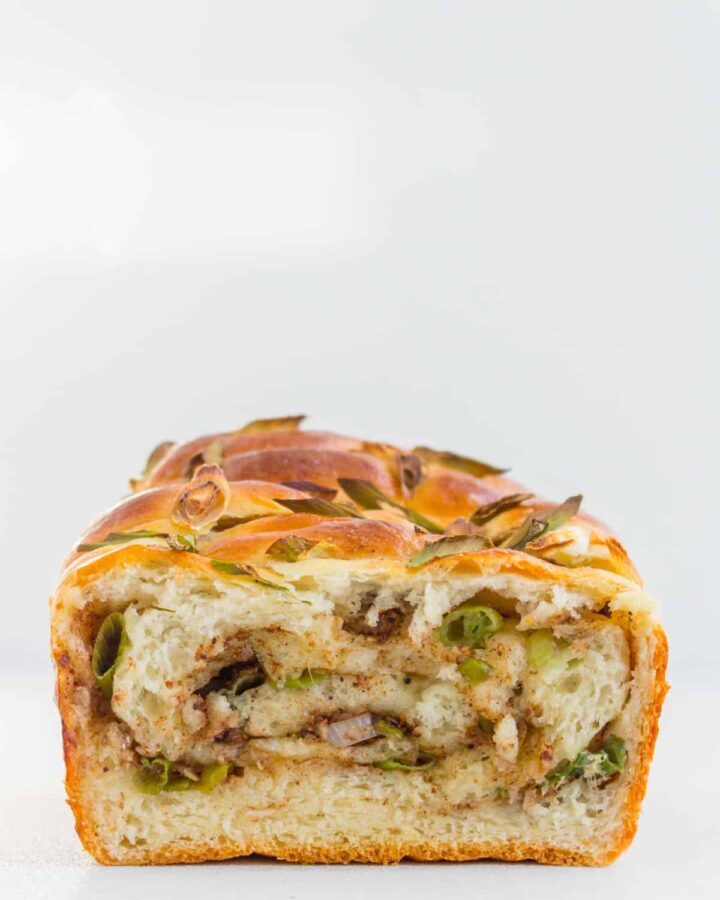 The inside of the scallion milk bread showing the swirls.