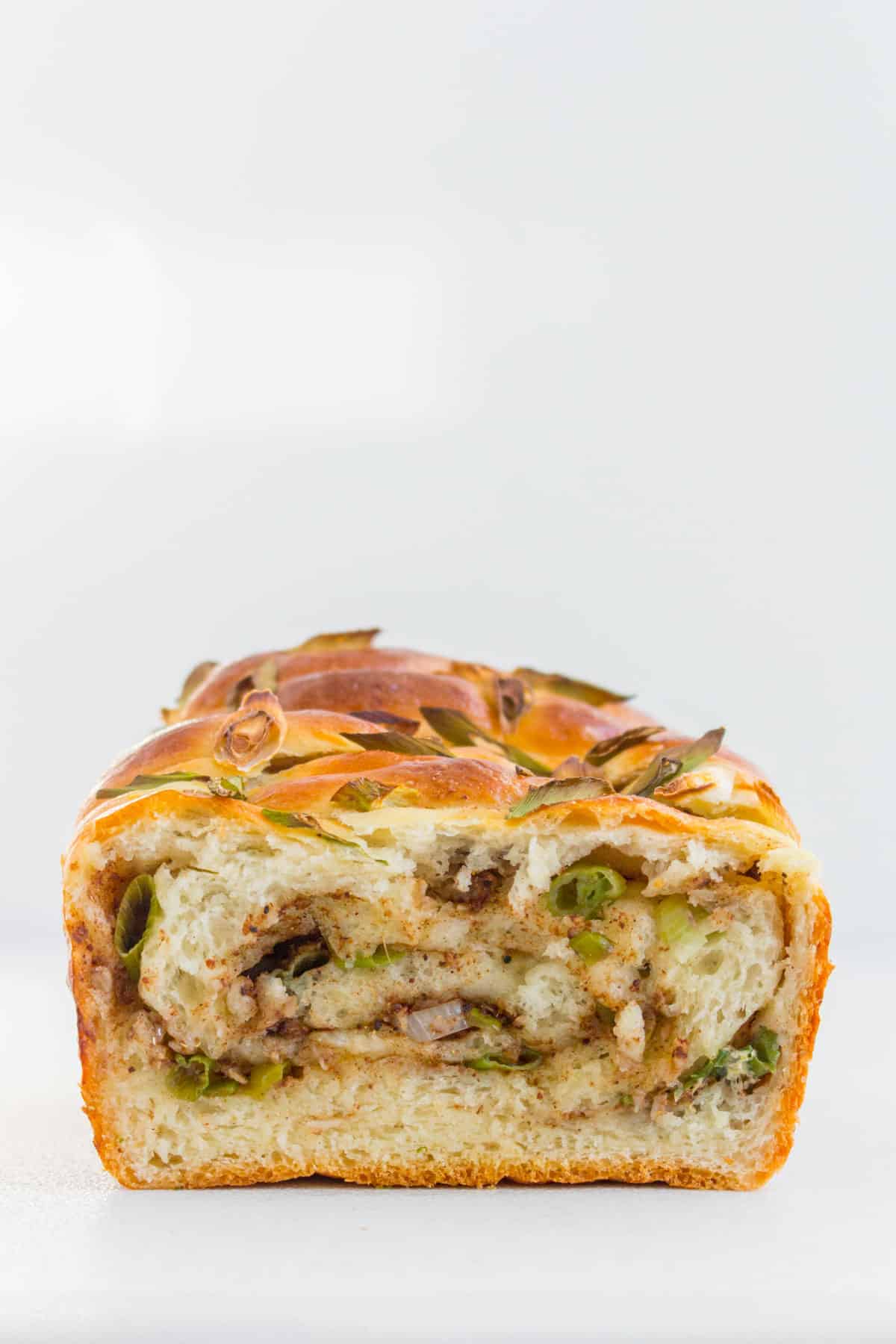 The inside of the scallion milk bread showing the swirls.