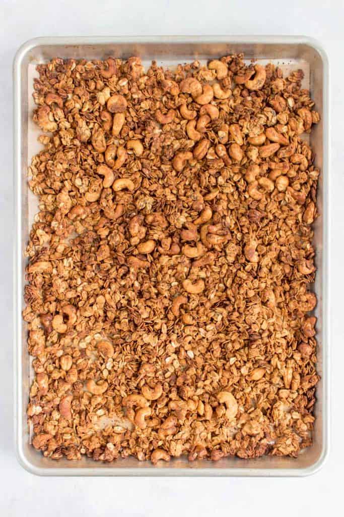 Cooked granola on a sheet pan.