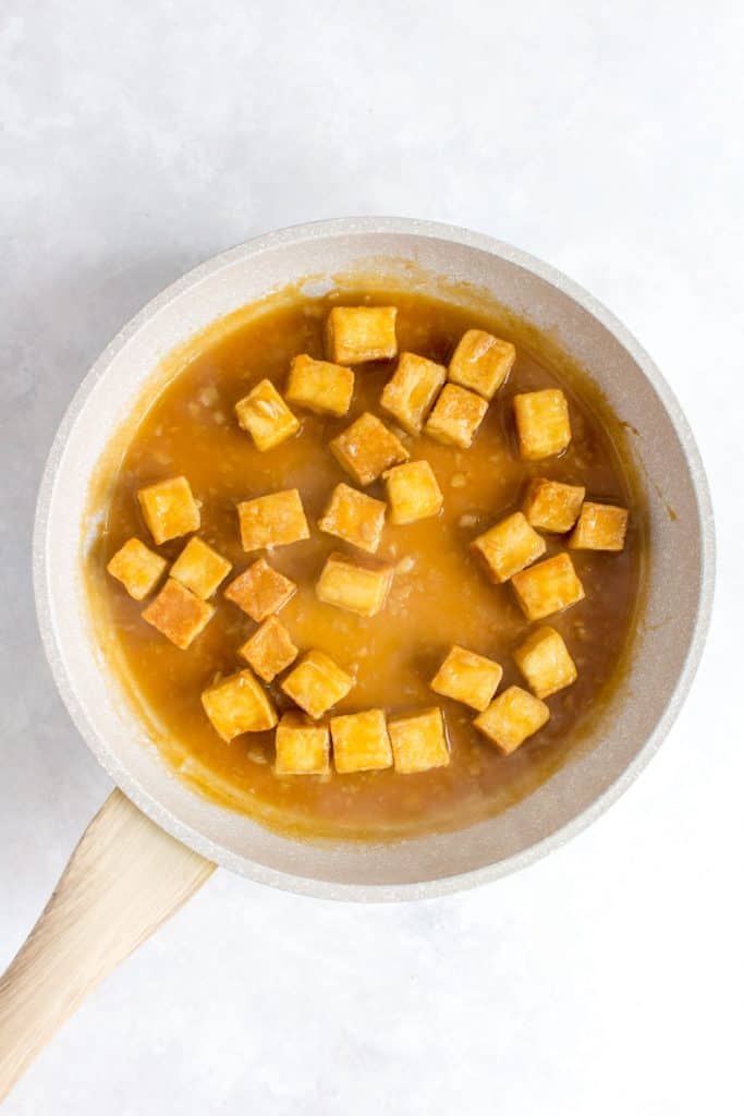 Pan fried crispy tofu in orange sauce.