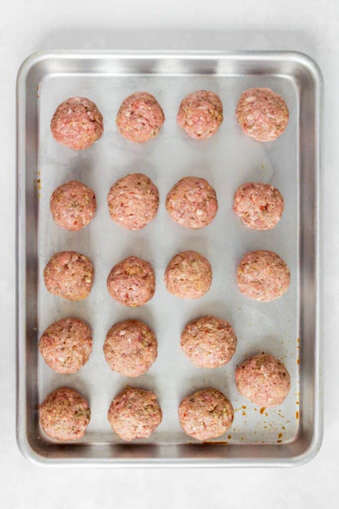 19 meatballs on a sheet pan.