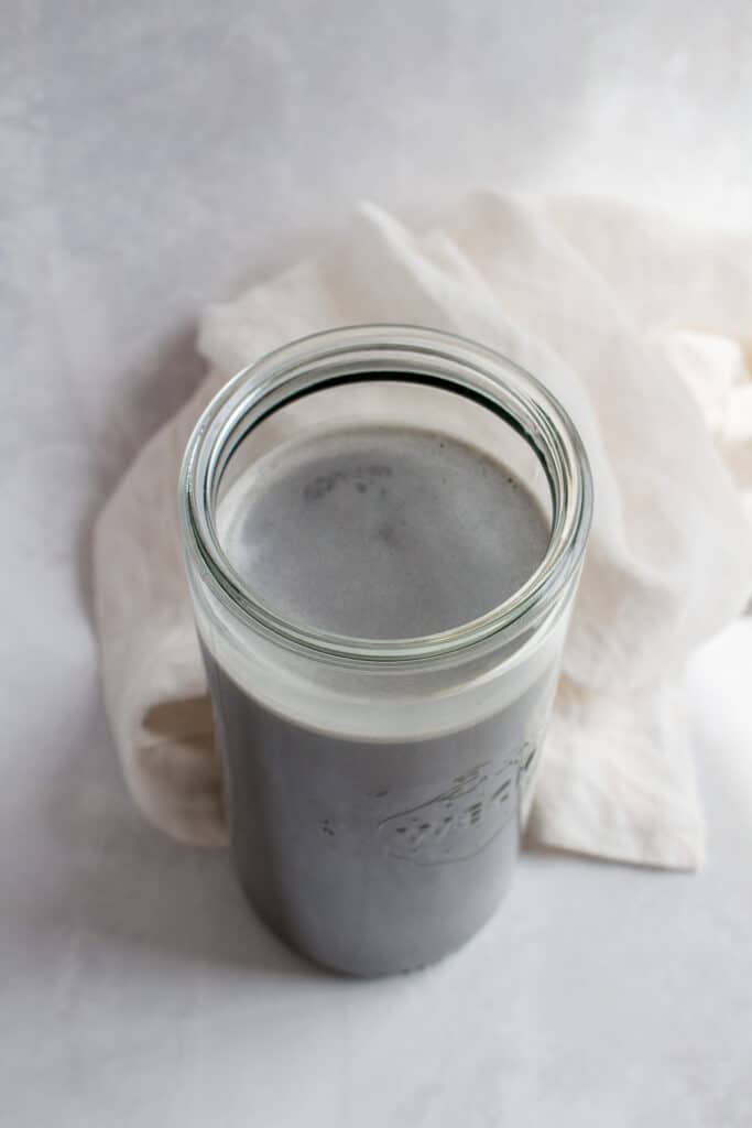 Overhead view of a weck jar of black sesame milk.