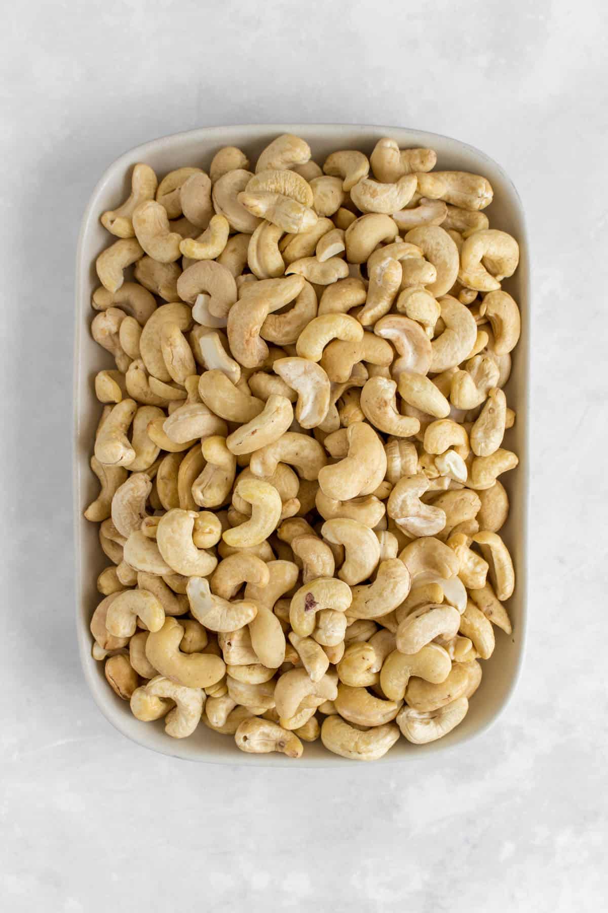 A plate of a raw cashews.