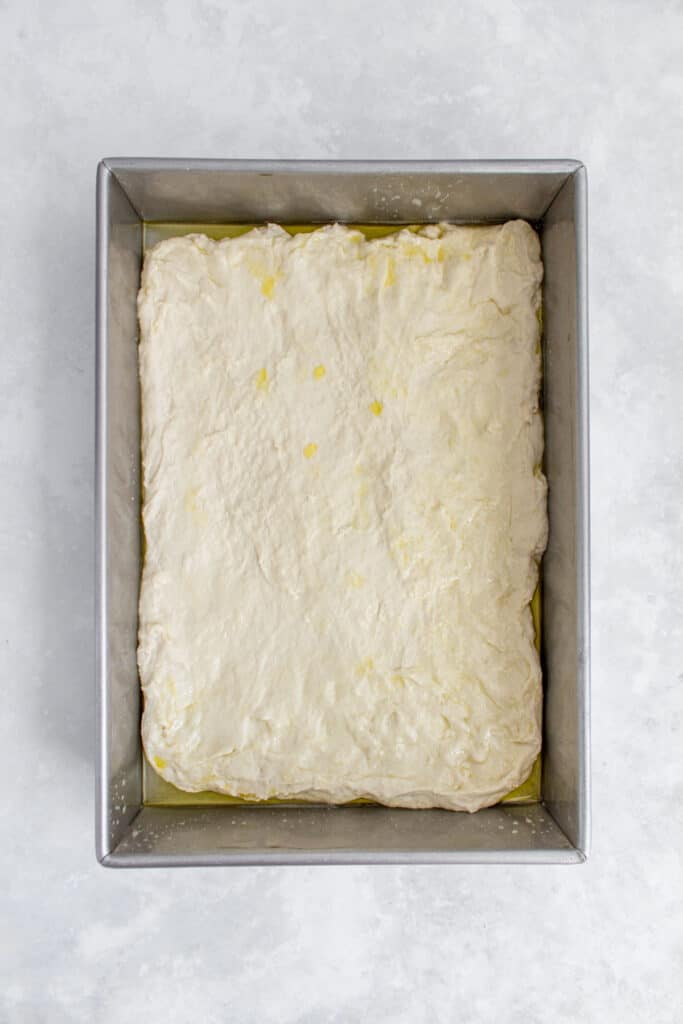 Focaccia dough in a 9"x13" pan.