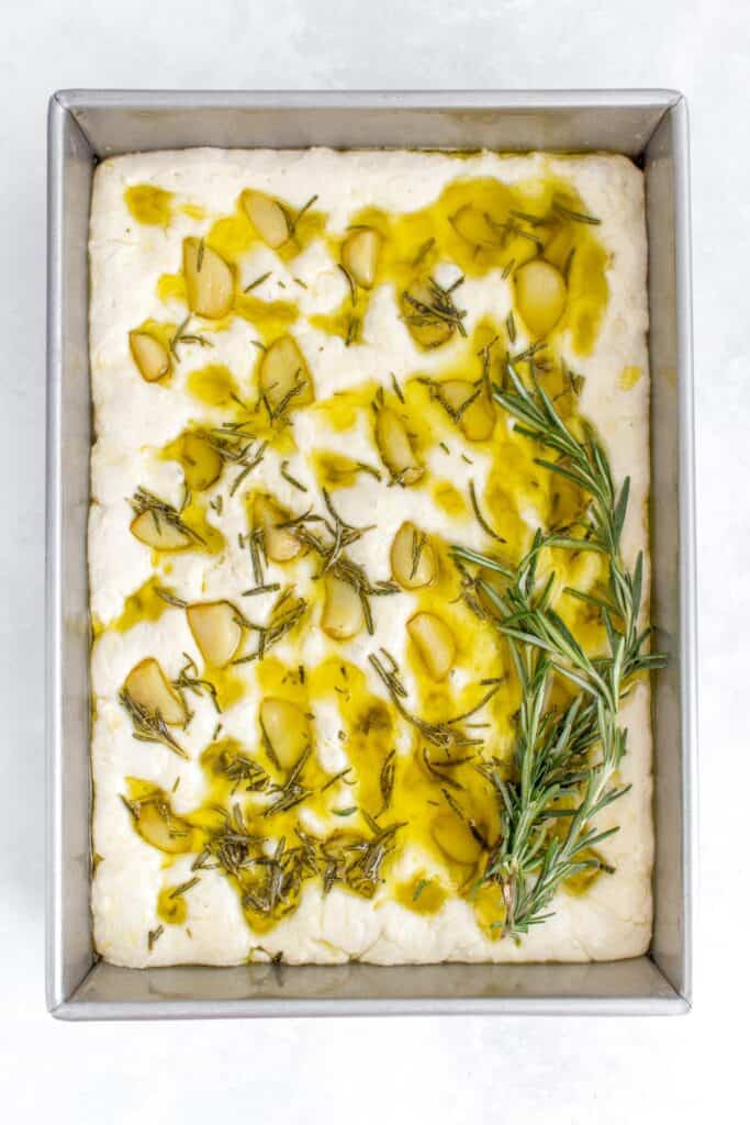 Olive oil and rosemary added to the focaccia.