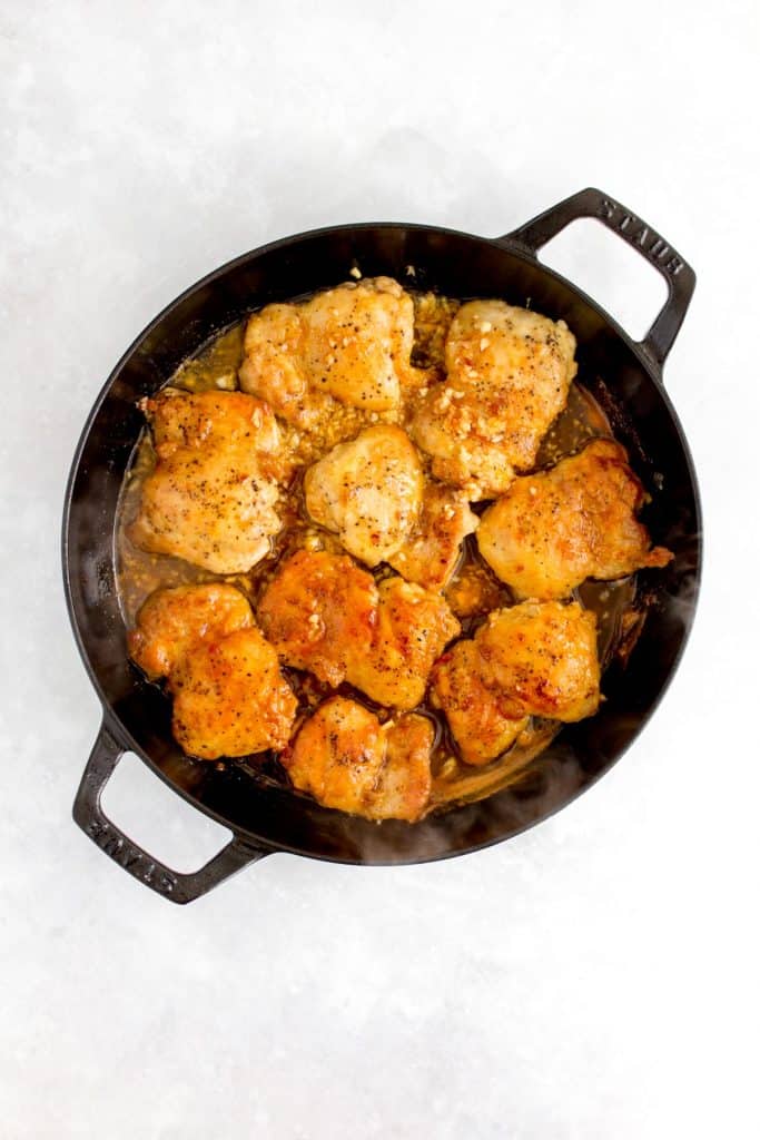 Spicy honey sauce added to the pan of chicken.