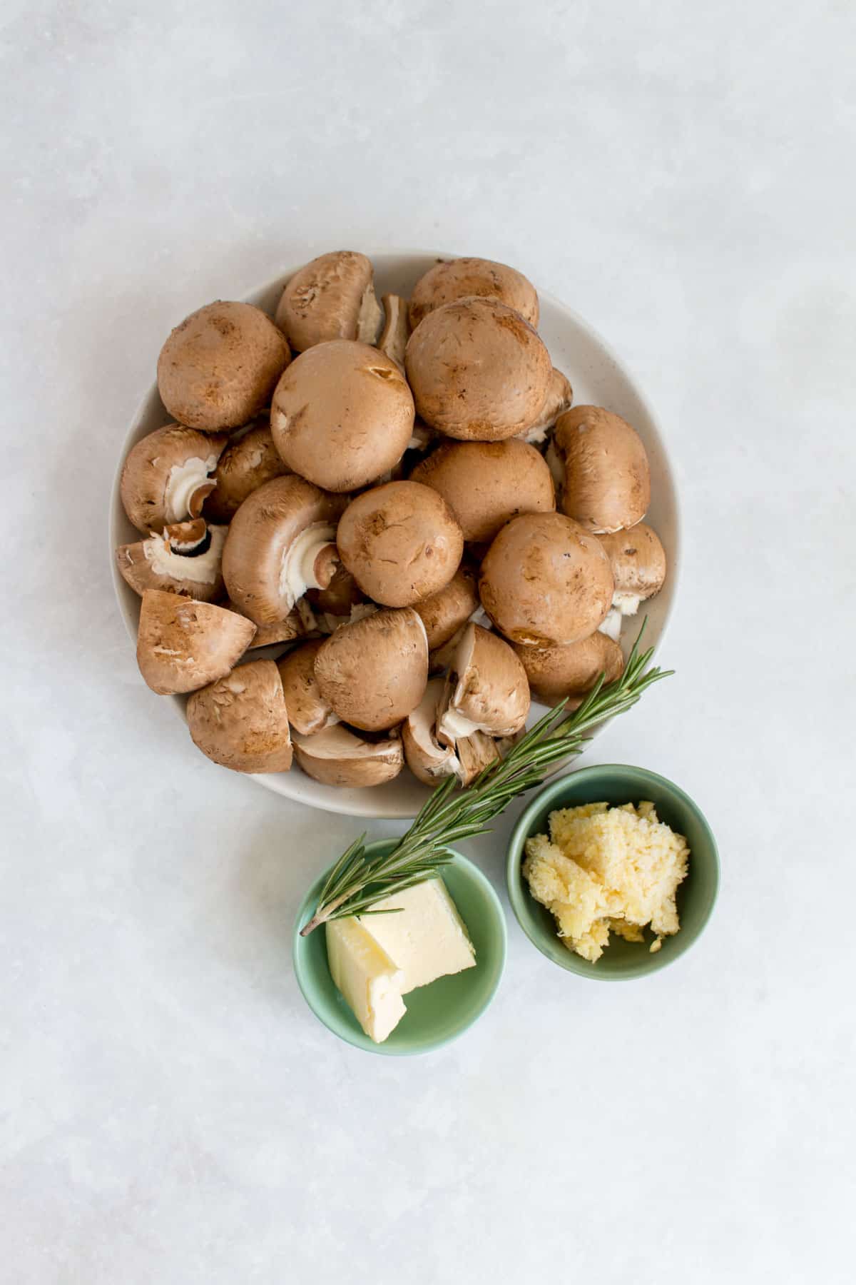 Ingredients needed to make garlic butter rosemary mushrooms.