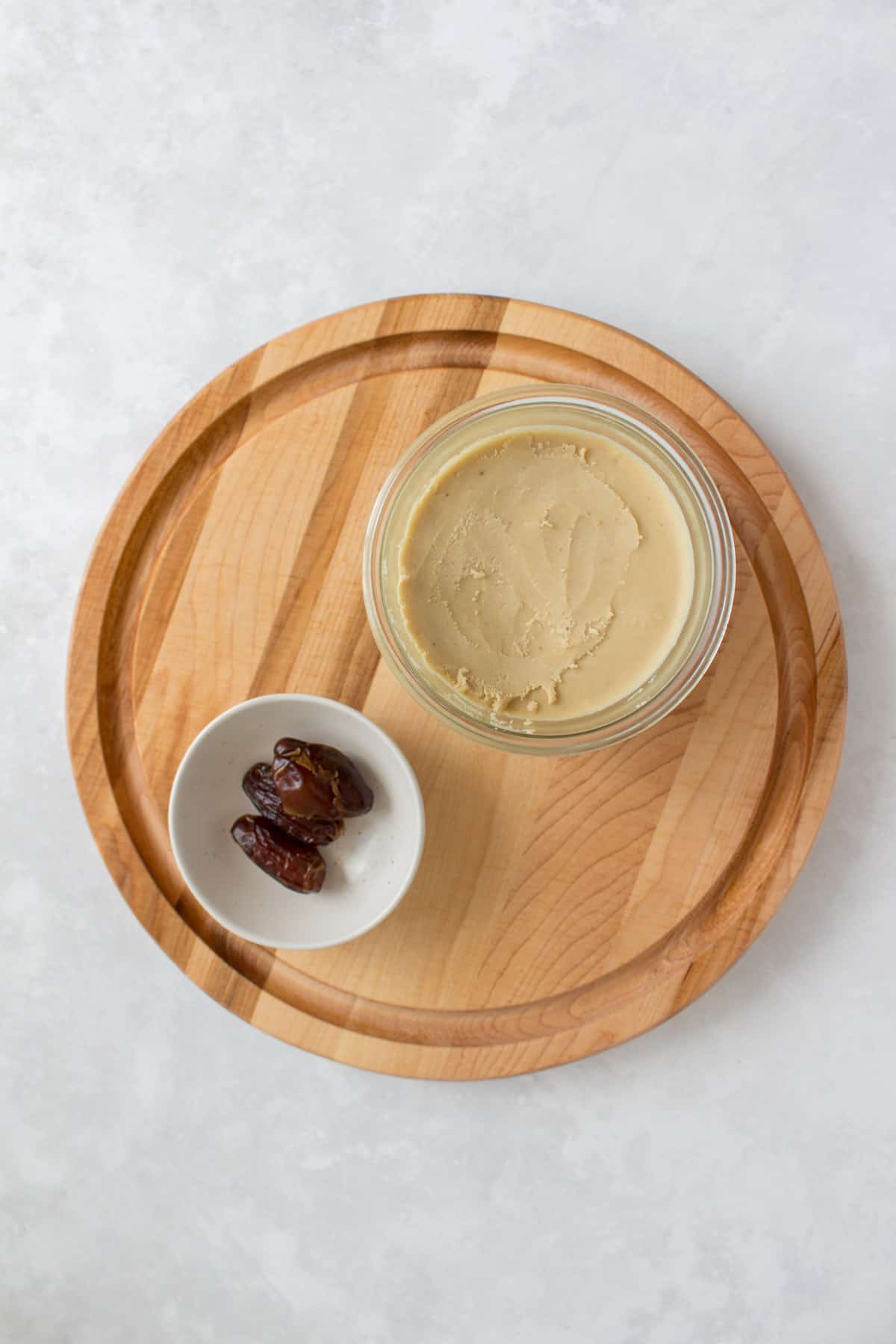 Overhead view of cashew butter and dates.