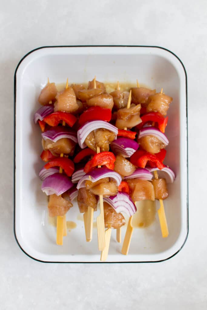 Chicken skewers ready to be grilled.