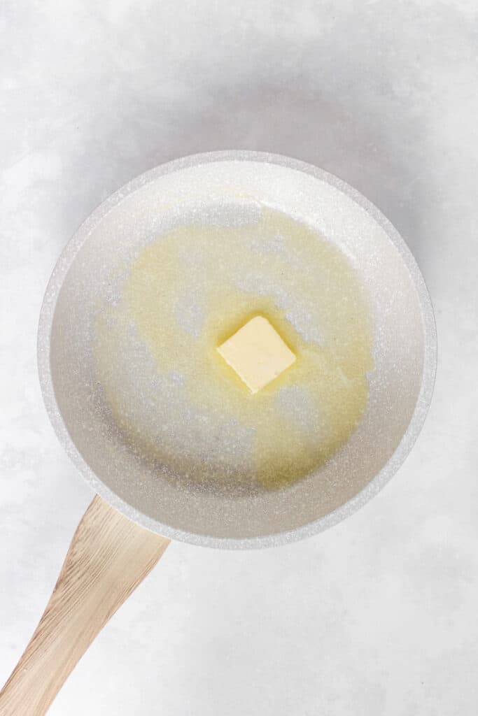 Butter melted in a skillet.