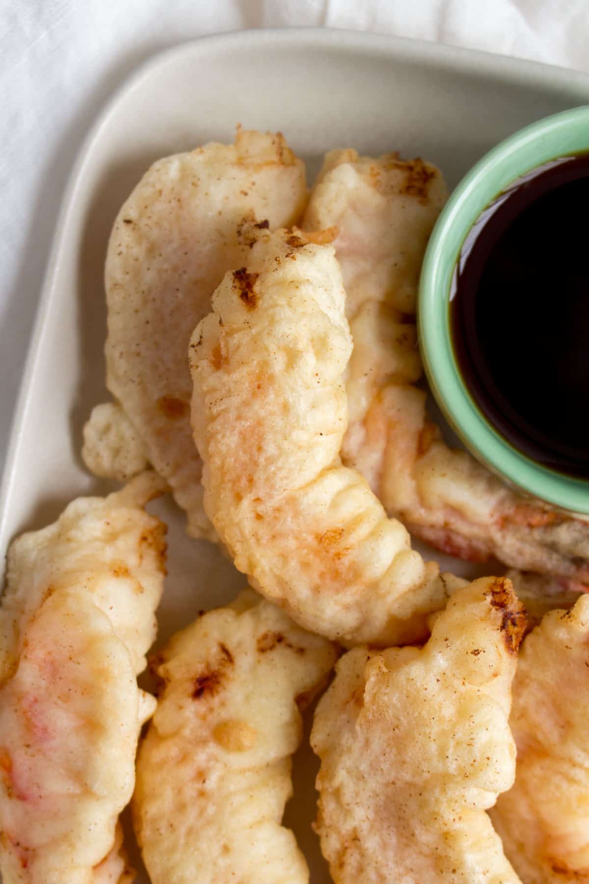 Close up of shrimp tempura on a plate.