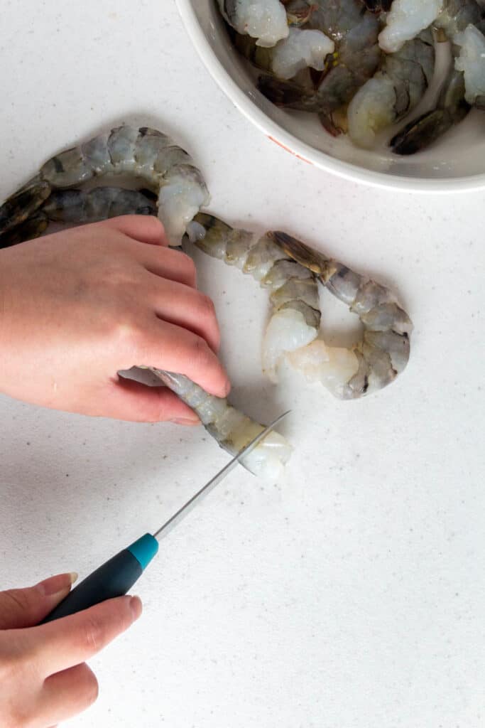 Shrimp being cut.