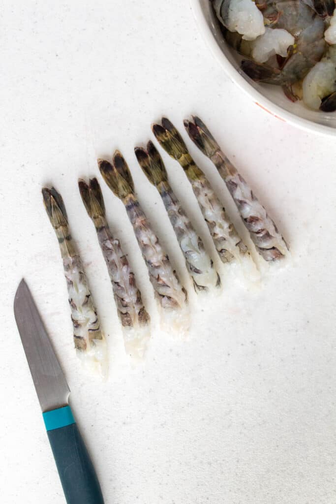 Prepared shrimp on a cutting board.
