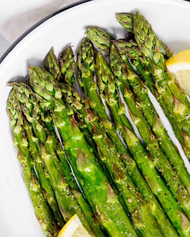 Close up of asparagus cooked in an air fryer.