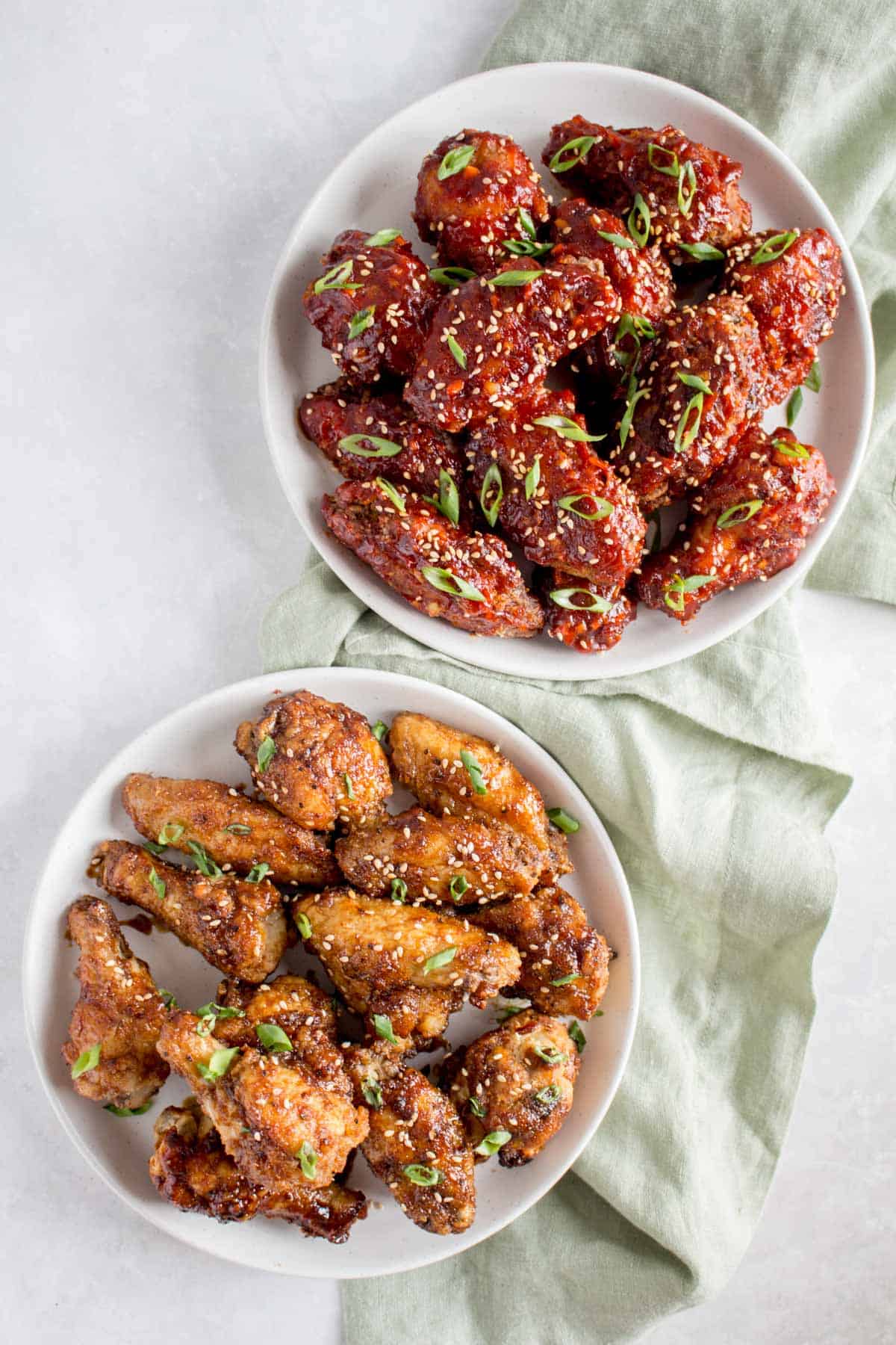 Overhead views of Korean chicken, one deep fried, one air fried.