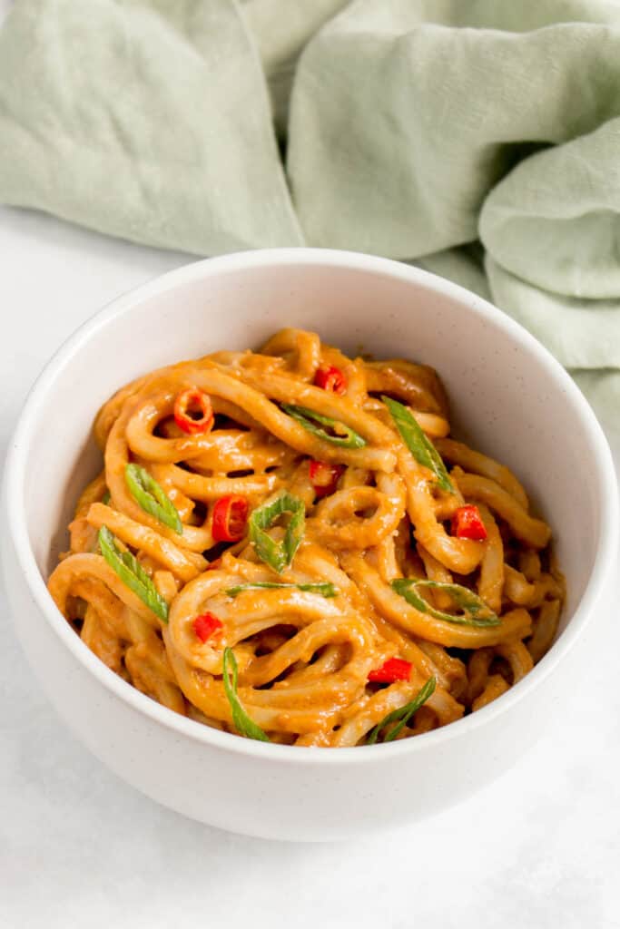 A bowl of spicy peanut noodles.