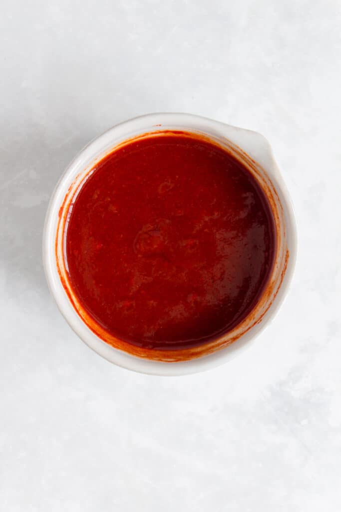 Sweet and spicy sauce in a spouted bowl.