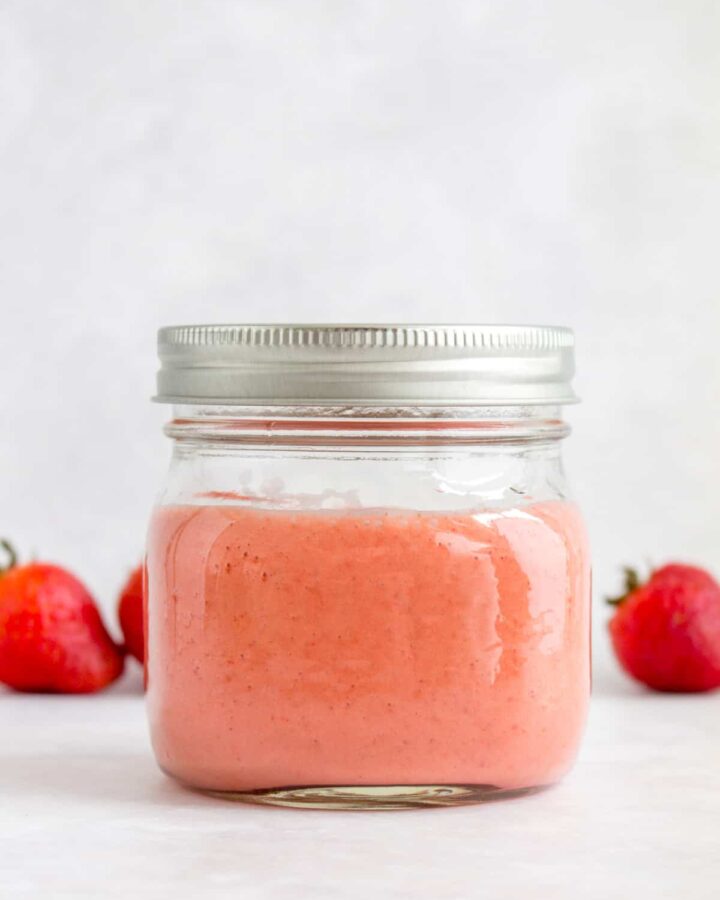 A mason jar of strawberry vinaigrette.