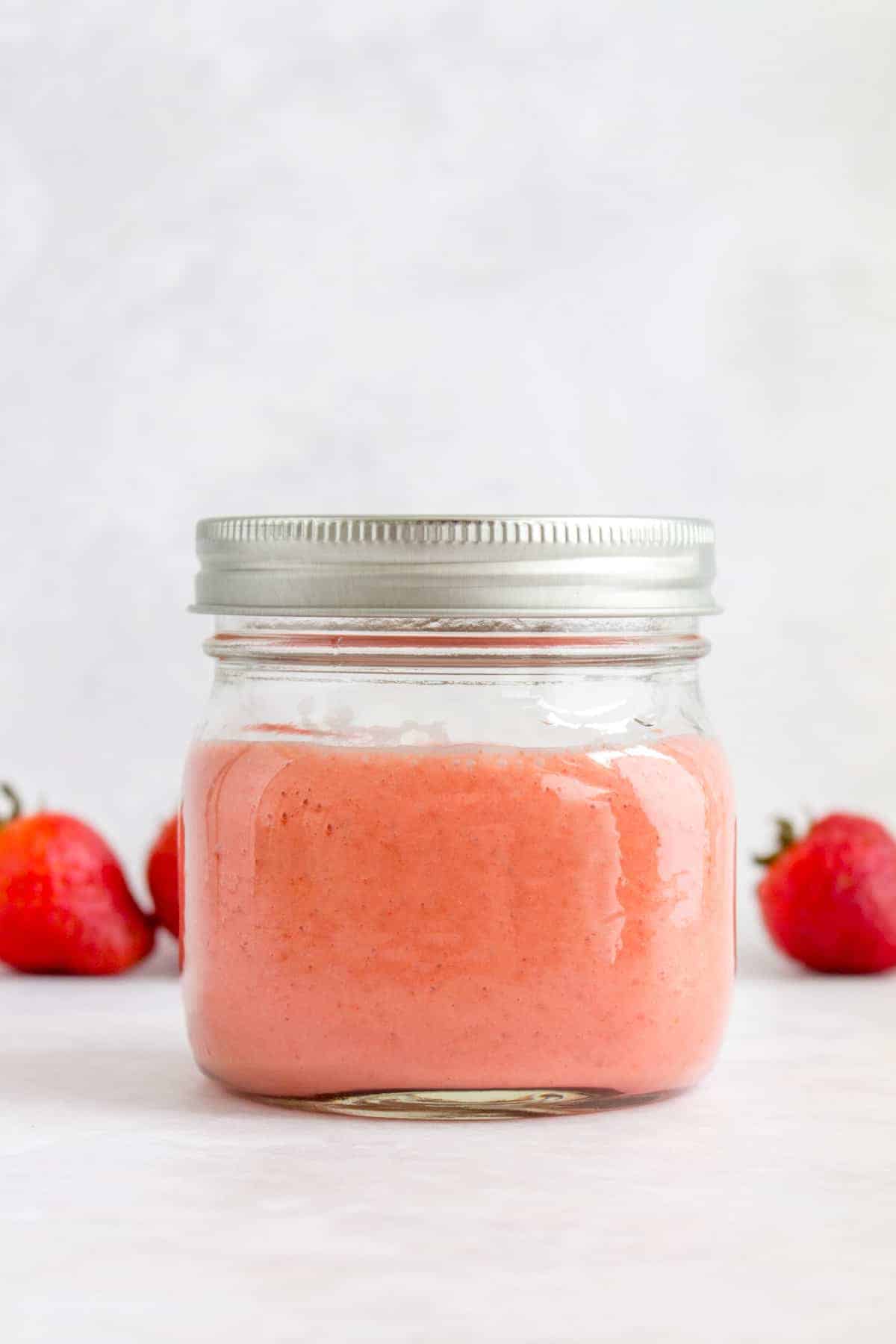 A mason jar of strawberry vinaigrette.