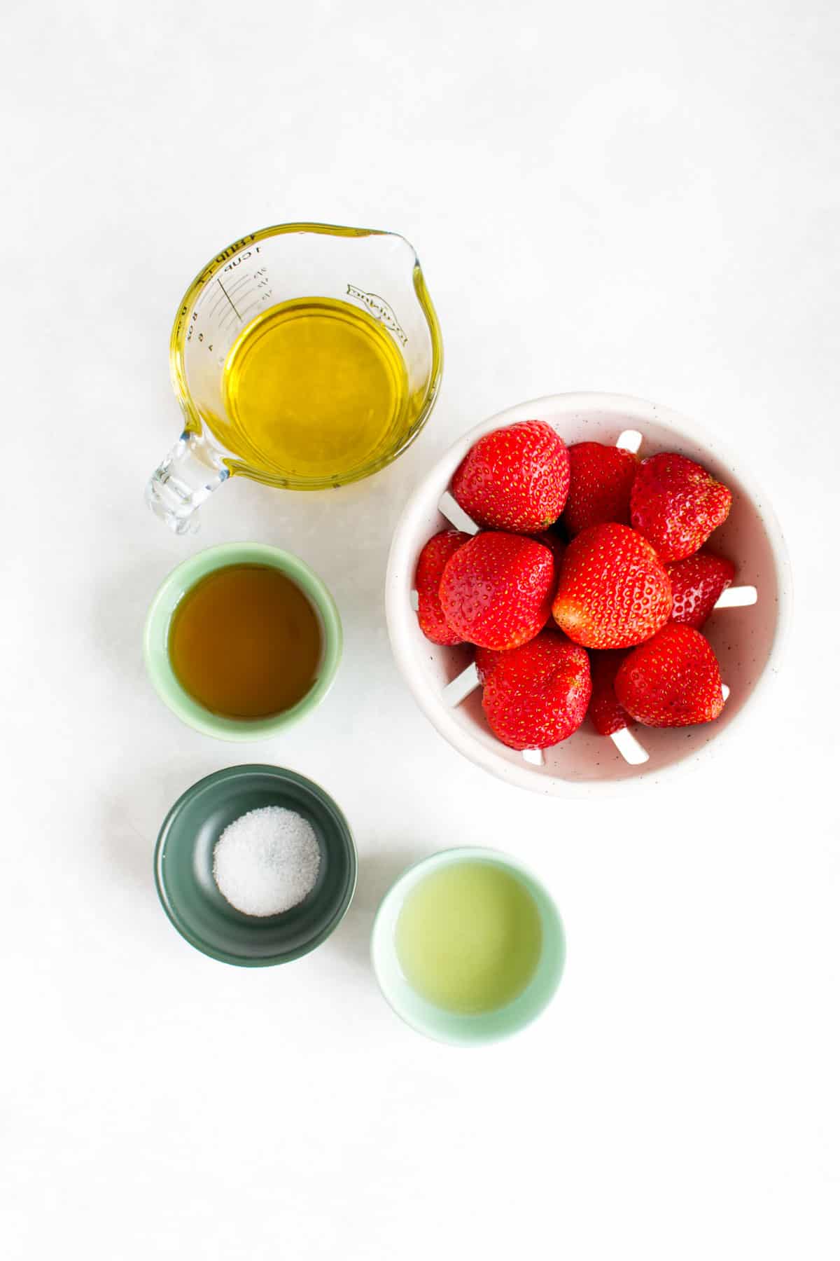 Ingredients needed to make a strawberry vinaigrette.