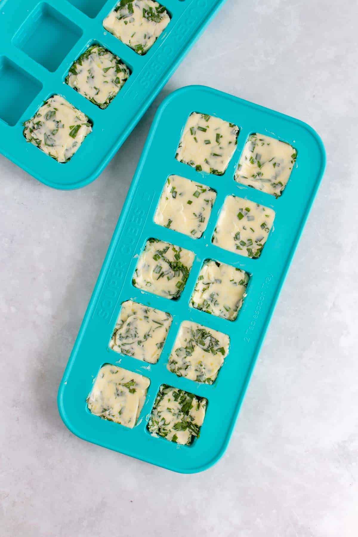 Compound herb butter in souper cubes containers.