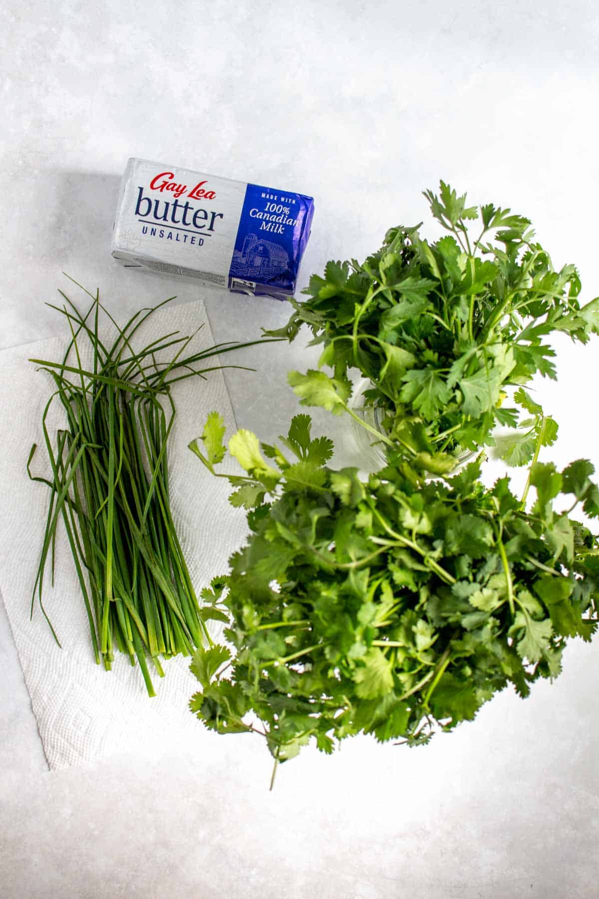 Ingredients needed to make herb butter.