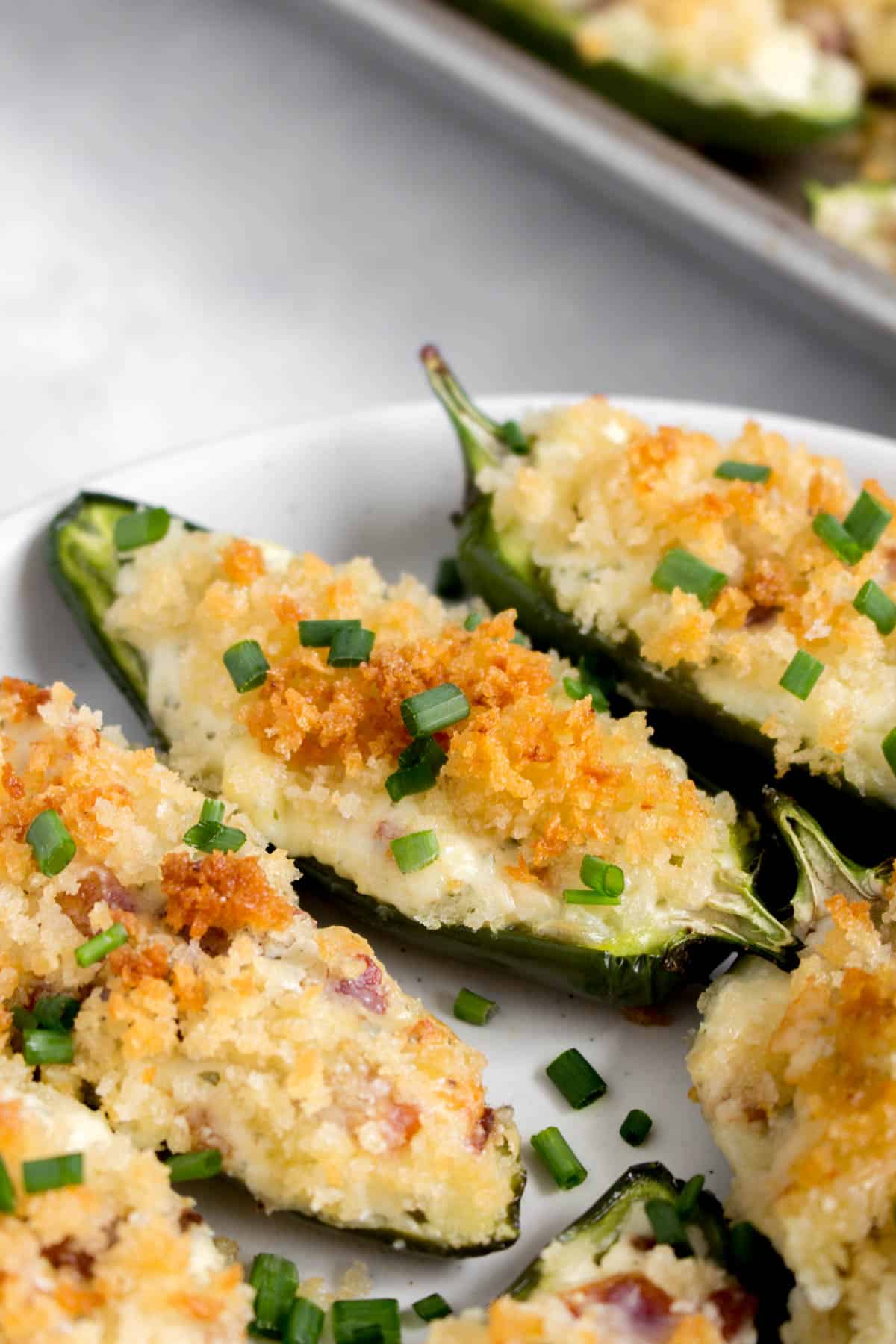 Close up of a jalapeno poppers on a plate.