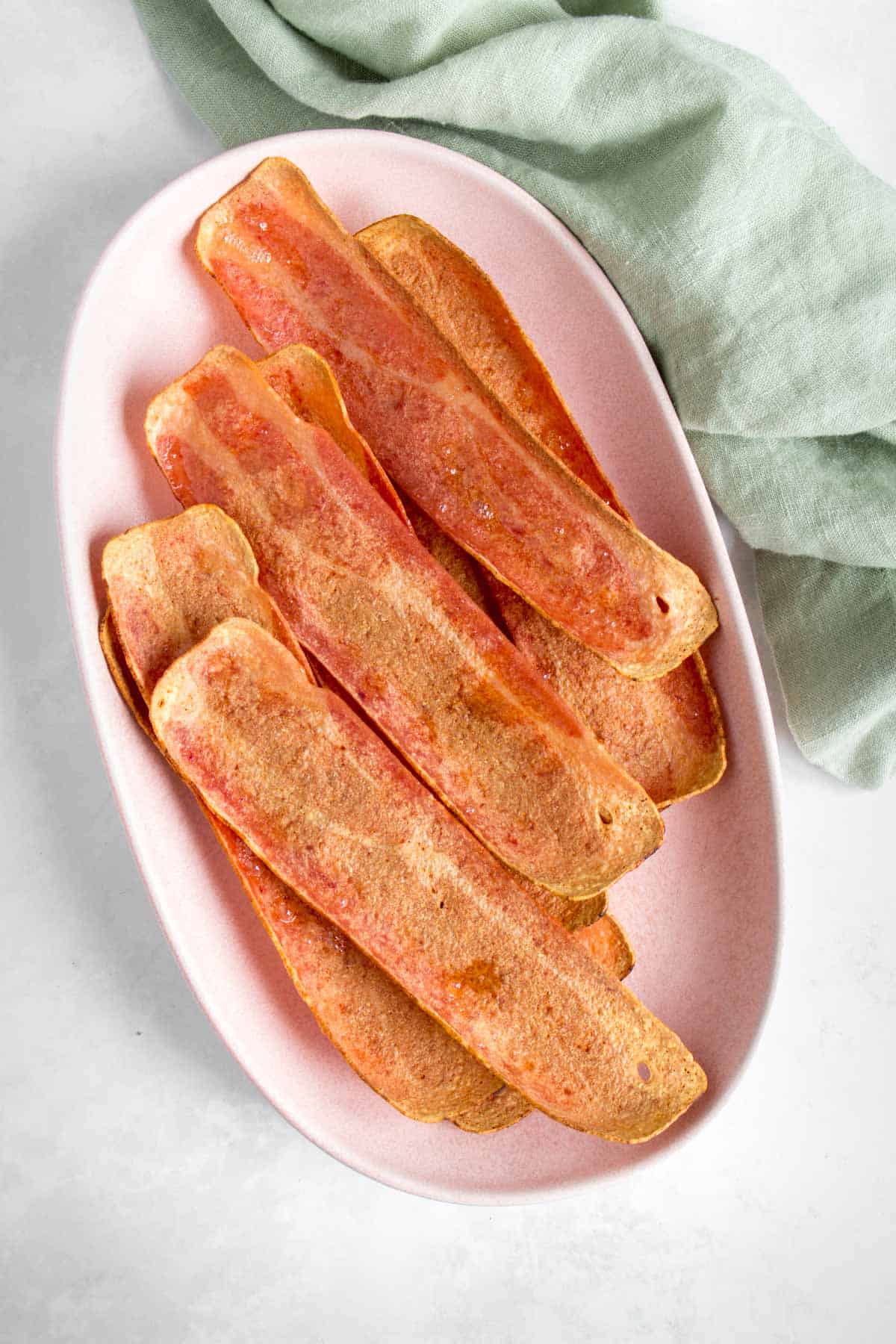 A platter of turkey bacon made in the oven.