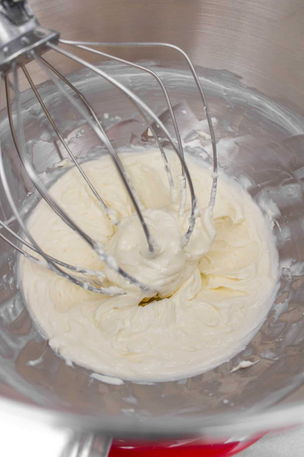 Cream cheese mixture beaten in a mixer.